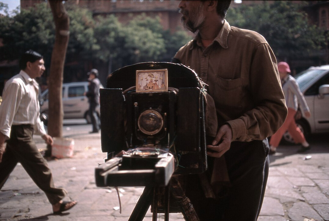 Swiss cameraman filming a vintage advertisement with a 16mm film camera in a television studio